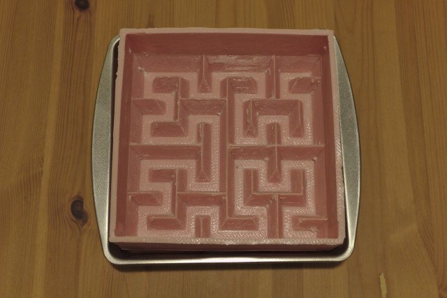 Greased Hilbert curve cake mold