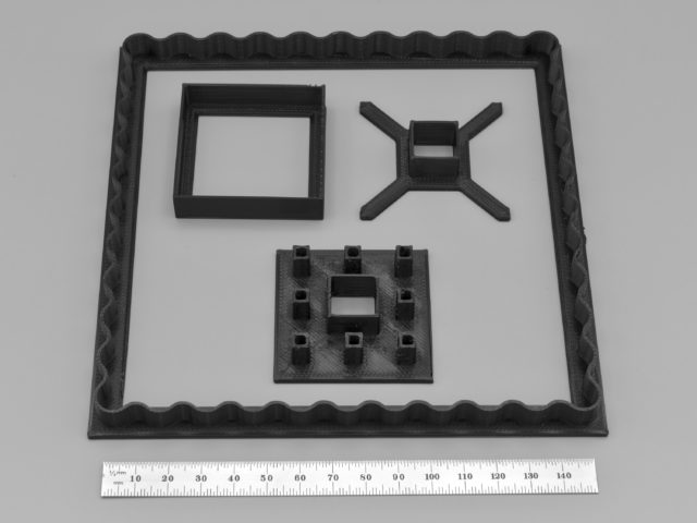 Photo of cookie cutters for a Sierpiński carpet Linzer